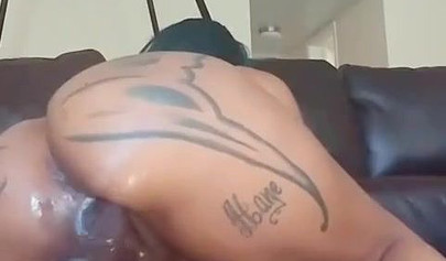 Inked ebony doll Brittney Jones gets fucked by a machine dildo