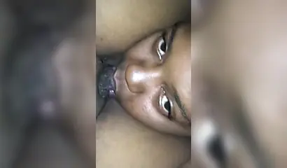 Ebony sugar babe licking a black clitoris up close