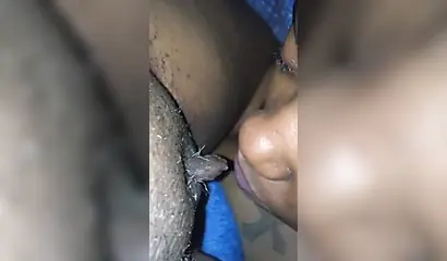 Ebony sugar babe licking a black clitoris up close