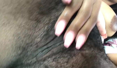 African nympho fingering and toying her bushy twat