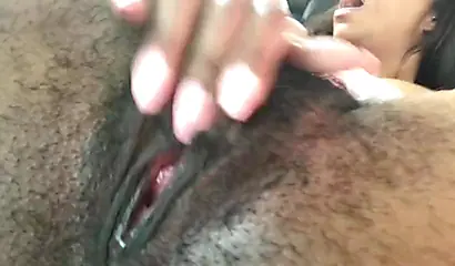 African nympho fingering and toying her bushy twat