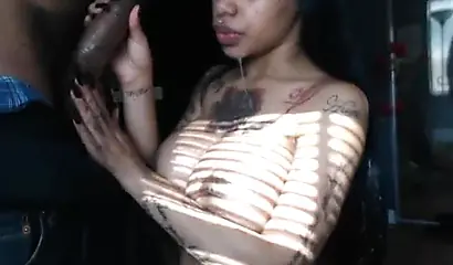 Busty tattooed ebony gives a hot BJ and swallows cum