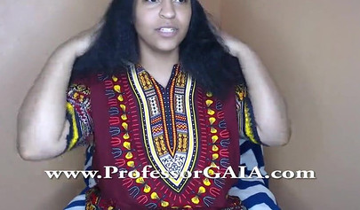 Exotic ebony lifts her dress up & shows her big tits & hairy pussy