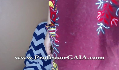 Exotic ebony lifts her dress up & shows her big tits & hairy pussy