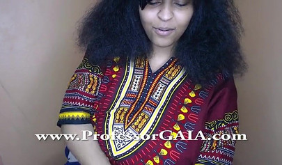 Exotic ebony lifts her dress up & shows her big tits & hairy pussy