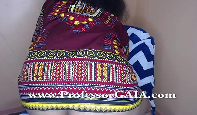 Exotic ebony lifts her dress up & shows her big tits & hairy pussy