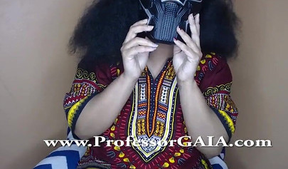 Exotic ebony lifts her dress up & shows her big tits & hairy pussy