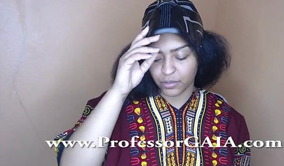 Exotic ebony lifts her dress up & shows her big tits & hairy pussy