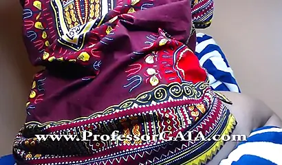 Exotic ebony lifts her dress up & shows her big tits & hairy pussy