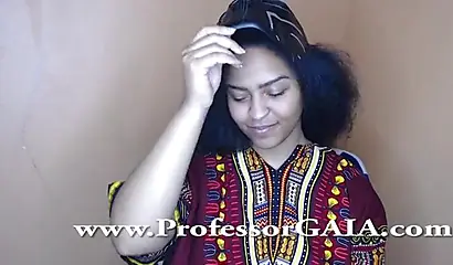 Exotic ebony lifts her dress up & shows her big tits & hairy pussy