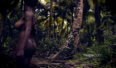 Big boobed Caribbean stunner posing and swimming naked