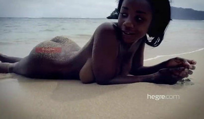 Big boobed Caribbean stunner posing and swimming naked