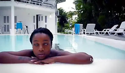 Big boobed Caribbean stunner posing and swimming naked