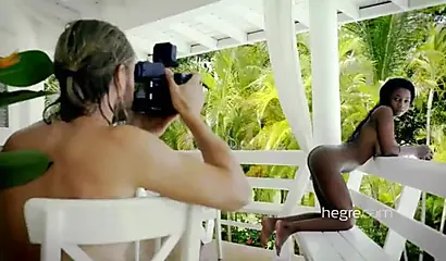 Big boobed Caribbean stunner posing and swimming naked