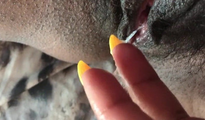 Black slut cums while masturbating up close