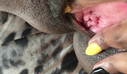 Black slut cums while masturbating up close