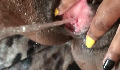 Black slut cums while masturbating up close