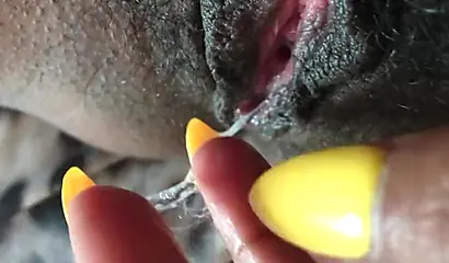 Black slut cums while masturbating up close