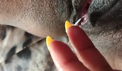 Black slut cums while masturbating up close
