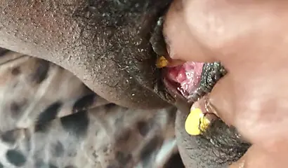 Black slut cums while masturbating up close