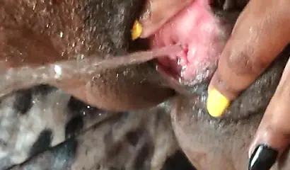 Black slut cums while masturbating up close