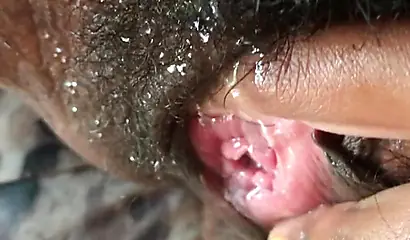 Black slut cums while masturbating up close