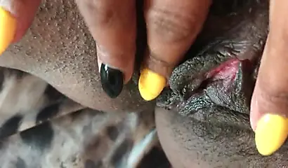 Black slut cums while masturbating up close