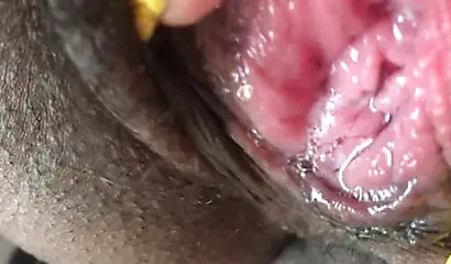 Black slut cums while masturbating up close