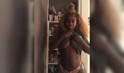 Playful ebony lifts her shirt up and shows her tits on IG