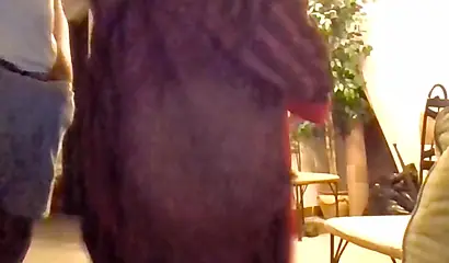 African wife kneels down and sucks a large black dick