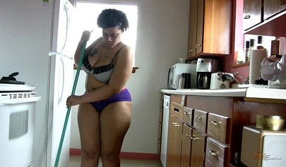 Chubby cleaning lady shows off her monster curves as she strips