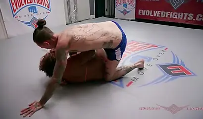 Ebony wrestler Daisy Ducati fights and fucks her tattooed partner