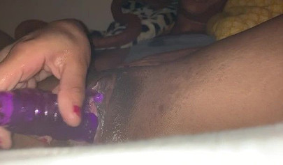 Lonely black slut toying her snatch at late night