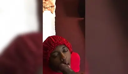 Black nympho with a nose ring sucking a huge ebony dick