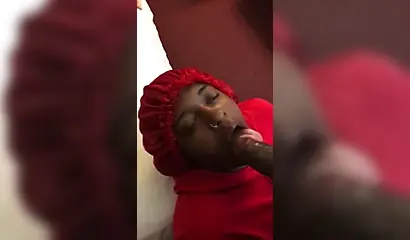 Black nympho with a nose ring sucking a huge ebony dick