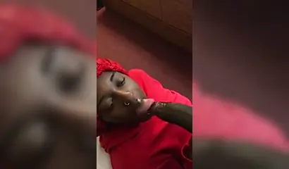 Black nympho with a nose ring sucking a huge ebony dick