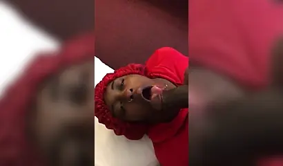 Black nympho with a nose ring sucking a huge ebony dick