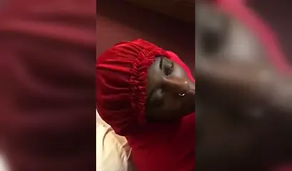 Black nympho with a nose ring sucking a huge ebony dick