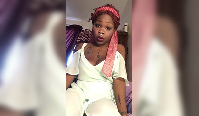 Redheaded ebony with a nose ring screws her black pussy with a white dildo