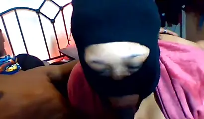 Masked ebony BBW sits on her lover's face & sucks a BBC