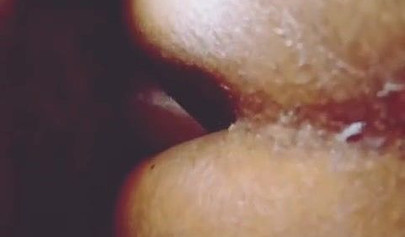 Redheaded ebony whore taking a doggy pounding