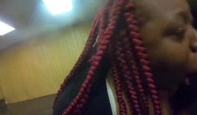 Redheaded ebony whore taking a doggy pounding