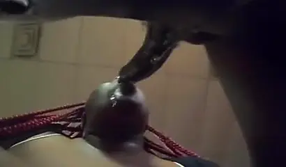 Redheaded ebony whore taking a doggy pounding