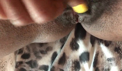 Slutty ebony rubbing her hairy muff up close