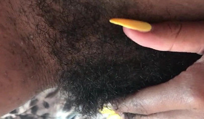 Slutty ebony rubbing her hairy muff up close