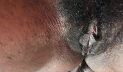 Slutty ebony rubbing her hairy muff up close