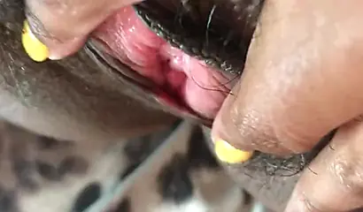 Slutty ebony rubbing her hairy muff up close