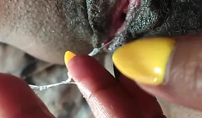 Slutty ebony rubbing her hairy muff up close