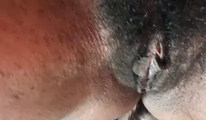 Slutty ebony rubbing her hairy muff up close
