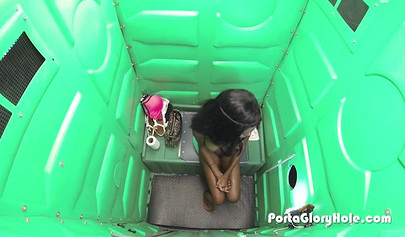 Insatiable ebony teen sucks white wiener through a gloryhole